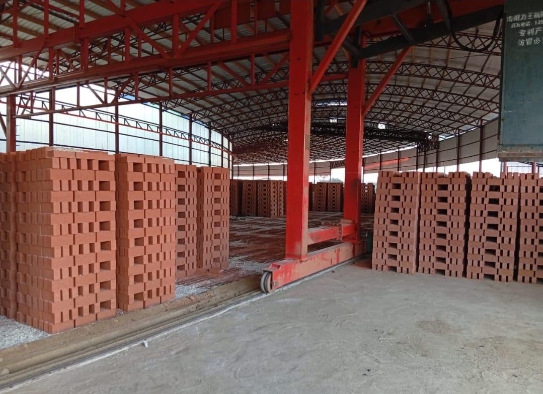 Pallets of Hexham clay bricks stacked under cover at a distribution centre