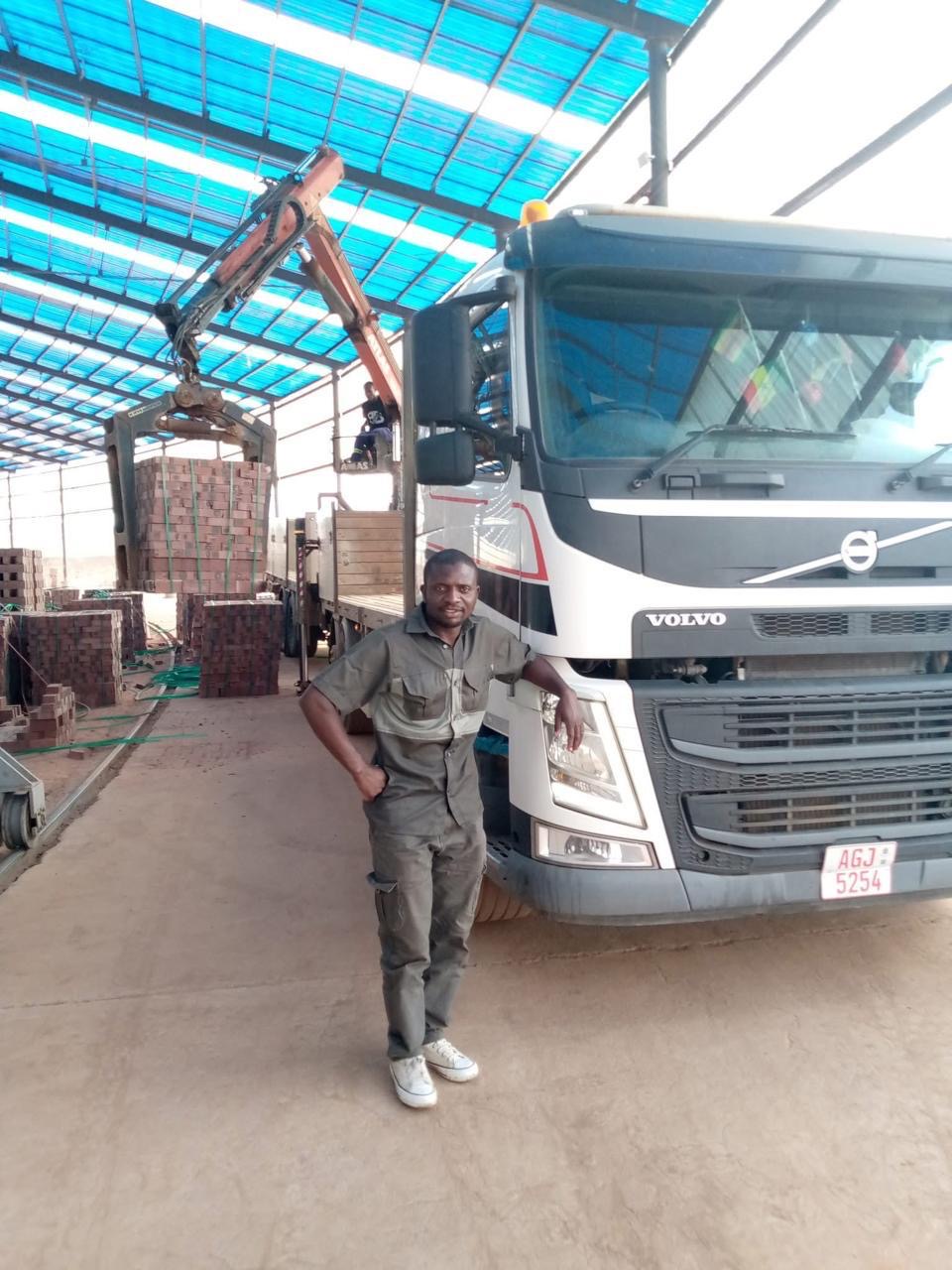 Hexham Express driver with a grab truck at a brick distribution centre